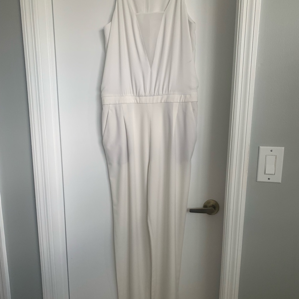 Slightly worn BCBG  jumpsuit size 8, off-white.